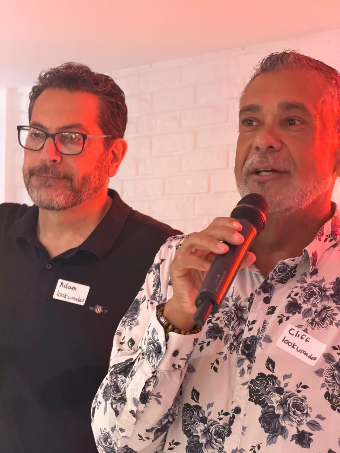 Adam and Cliff speaking together at the gathering