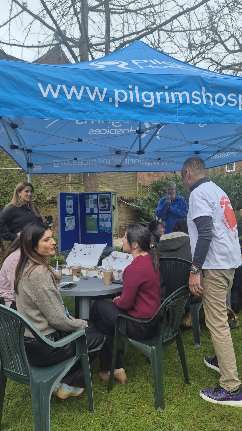 Sharing Loukoumades and conversation under the Pilgrims Hospices gazebo