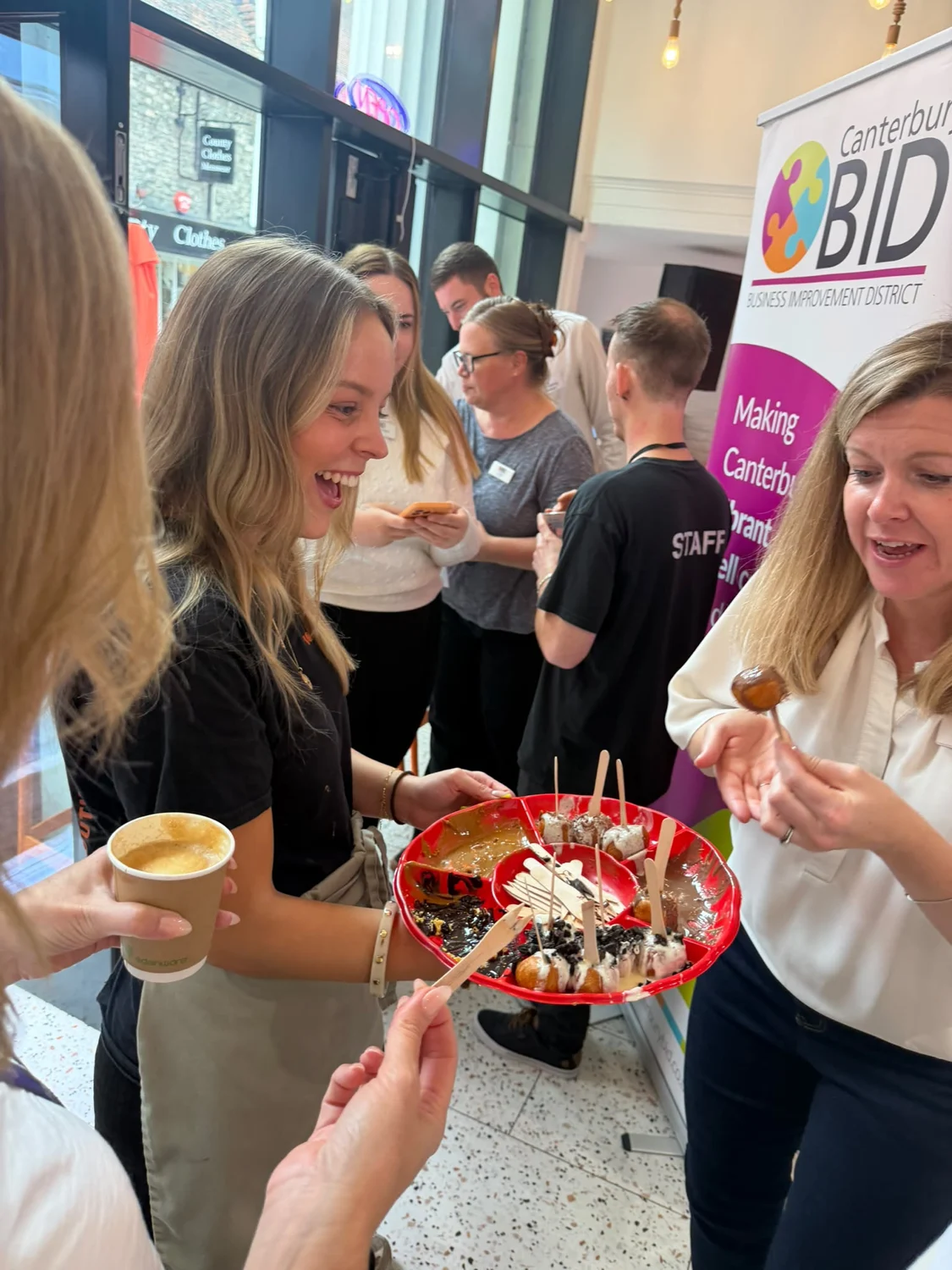 Guests trying Loukoumades together at Lookumades