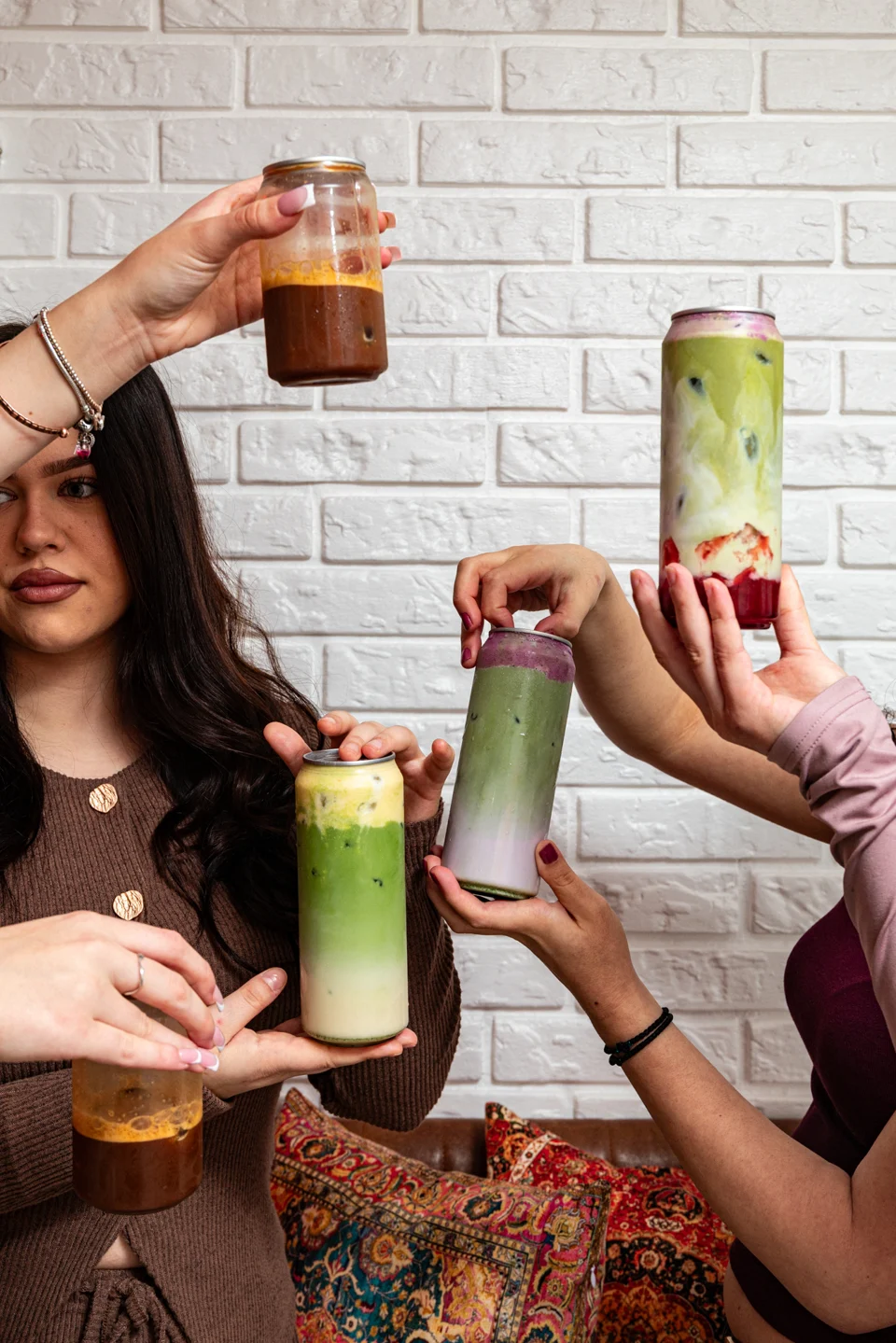 A selection of Lookumades matcha and coffee drinks raised together